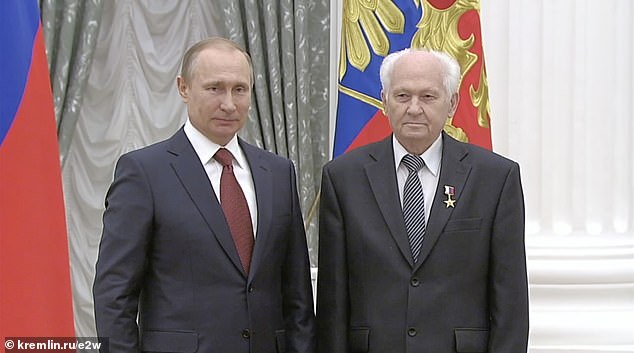 Pictured: Russia's top rocket specialist Pavel Kamnev and Russian President Vladimir Putin.