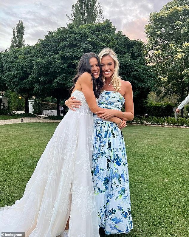 The stunning bride wore an embroidered bodice gown.  Seen here hugging a friend of his