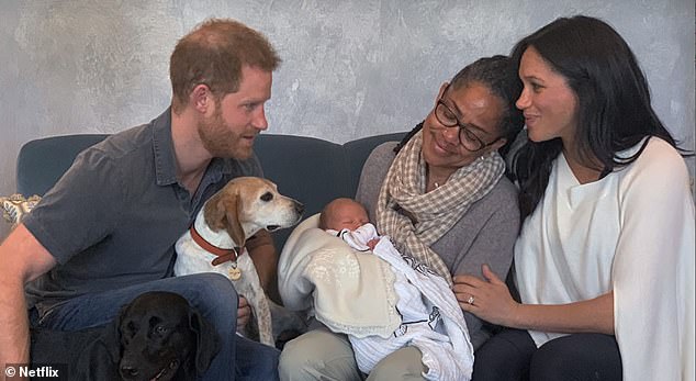 Prince Harry recalled that the couple ate Nando's, listened to Sanskrit music and that he hoarded the laughing gas during Meghan's first birth (pictured with son Archie and mother Doria Ragland in 2019).