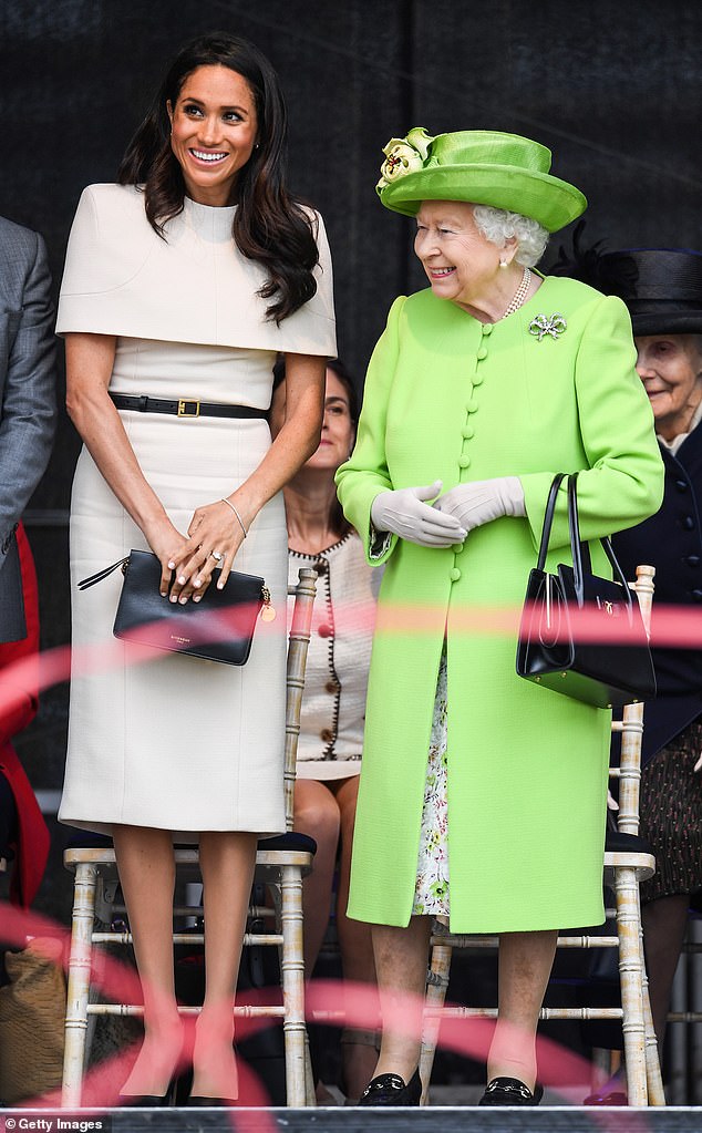 Meghan compared the 'surreal' encounter with the late Queen to a trip to the American themed dinner institution Medieval Times.  She is pictured with the Queen in Chester in 2018.