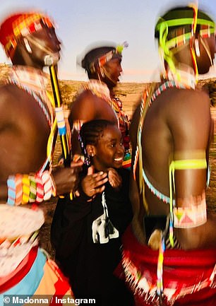 Twinning: Their youngest children, 10-year-old twins Stelle and Estere, seemed delighted to be a part of the fun.