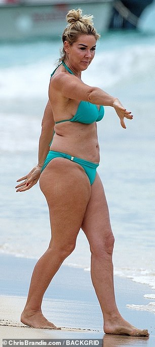 Stunning: The TV star was brimming with confidence as she flaunted her curves in a blue bikini