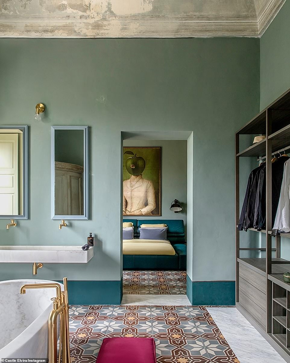 Unbelievable: Tile floors and free-standing marble bathrooms stand out in rooms that have giant artwork on the walls.