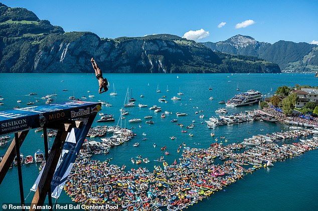 The staggering height from which the Chilean men leapt - 98ft - far eclipses the 88.5ft-high boards conquered by professionals competing in Red Bull's renowned World Cliff Diving series (Miguel Garcia of Colombia dives at the competition in Switzerland, September 11, 2022)