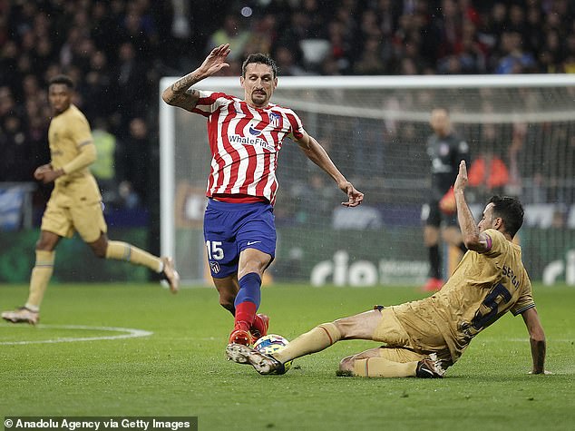 Busquets, pictured facing Atlético de Madrid star Stefan Savic, is also wanted by Inter Miami