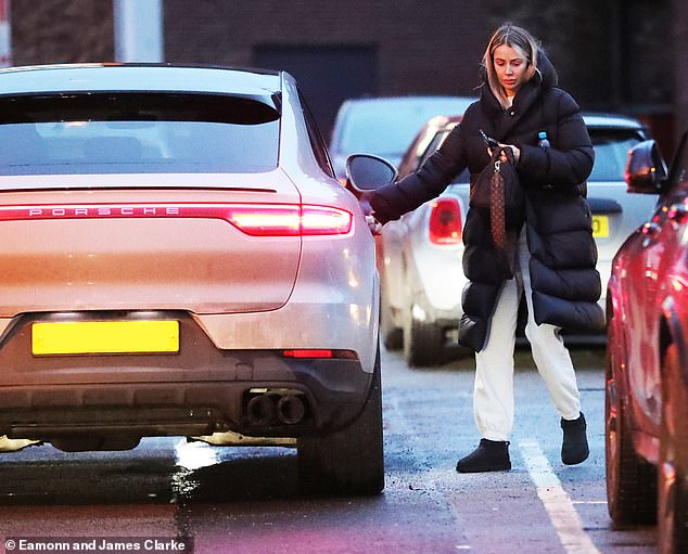 Hot wheels: After her outing, the model headed home in her sleek orange Porsche Cayenne after making a brief stop at the supermarket