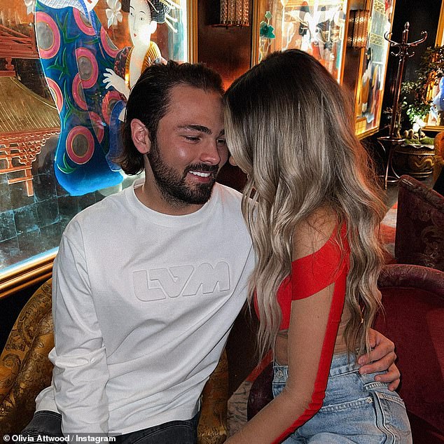 Happy couple: She could be seen in the same outfit in a picture posted last week of her sitting on boyfriend Bradley Dack's lap.