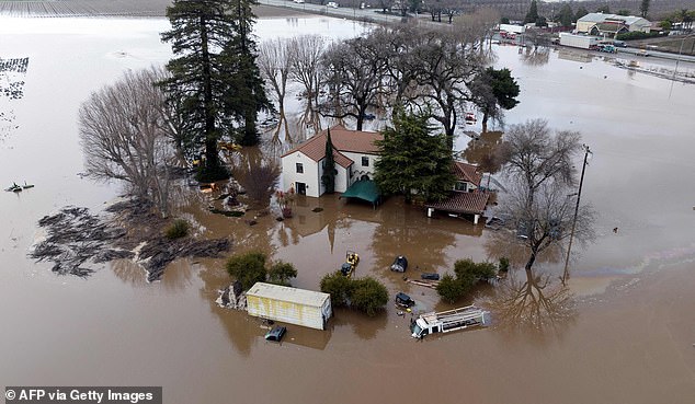 Pictured: This aerial view shows a flooded home partiallylikened  underwater in Gilroy, California, on January 9, 2023