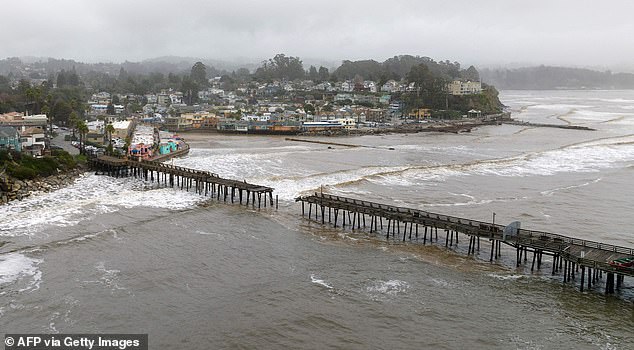 This aerial view shows a damaged pier is split in Capitola, California, on January 9, 2023