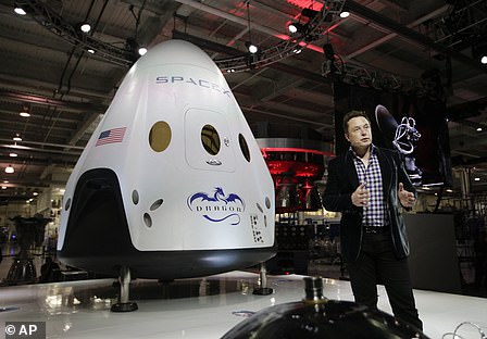 Elon Musk with Dragon Crew capsule