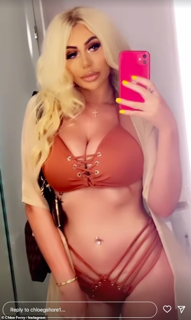 Confident: The reality star made sure to work all of her best angles as she reached out for mirror selfies