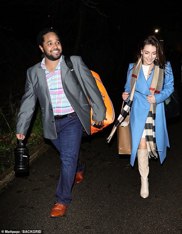 Looking good: Hamza cut a stylish figure in a gray blazer, teamed with a colorful shirt and a pair of blue jeans