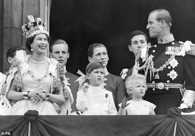 The then Prince Charles (centre) attends the coronation of his mother, Queen Elizabeth II (left), in 1953, following the death of his grandfather George VI.  It's now reportedly unlikely that Prince Harry will get a big father's day invite from him.