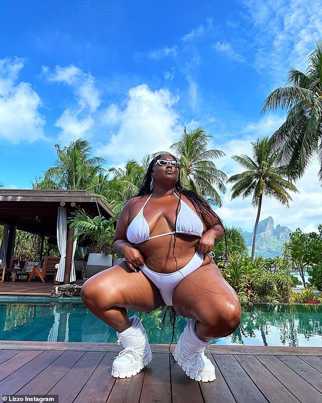 Tiny bikini: the 34-year-old singer-songwriter wore a white bikini that hugged her curves