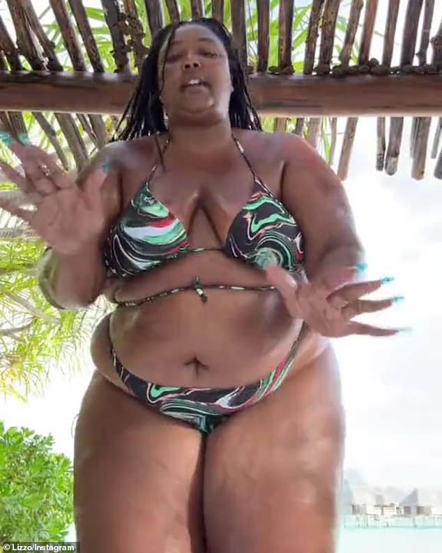 Take that!  The Truth Hurts singer struck back at the body-shamed on Friday in a video shared on Twitter.  Clad in a skimpy bikini, she shared exactly how she feels about haters picking on her size.