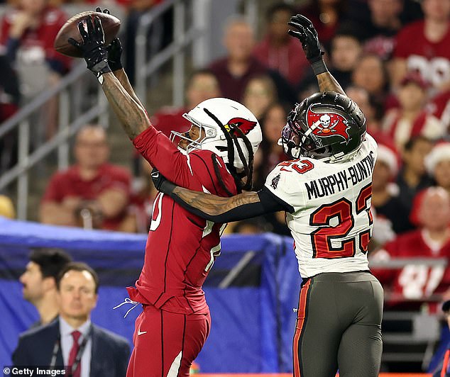 Hopkins goes up to catch Sean Murphy-Bunting #23 of the Tampa Bay Buccaneers