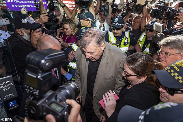 Pell (pictured front centre) arrives at Melbourne County Court in 2016 while fighting child sex charges which later saw him spend 13 months in jail before the High Court overturned all convictions.