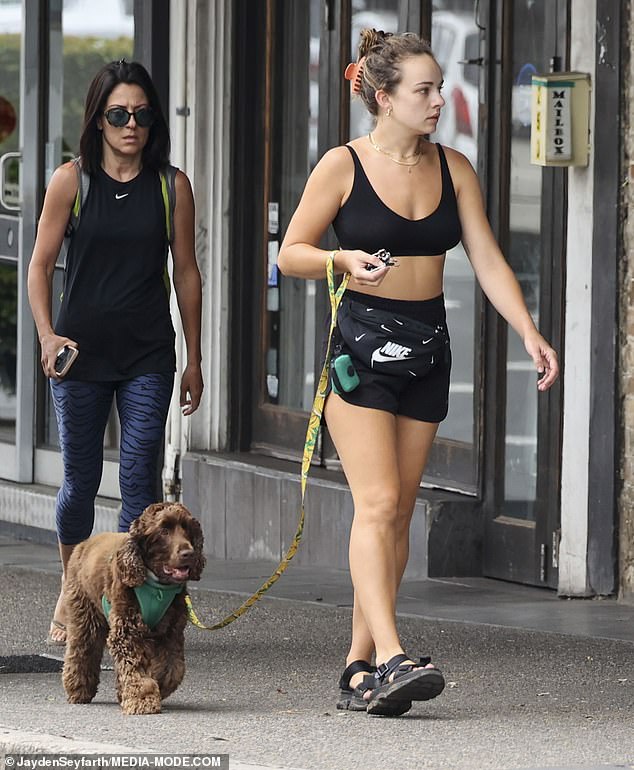 She accessorized with a few basic jewelry pieces, including gold hoop earrings and layered gold necklaces.