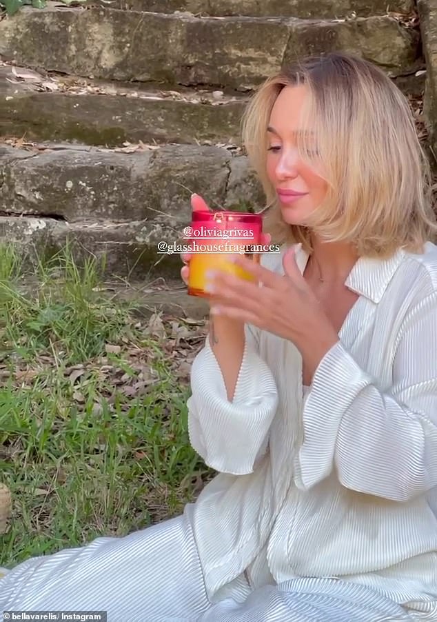 Bella sniffed at the Lychee Lime Fizz and Mango Bellini candles, before using the brightly colored jars as part of the decor on her picnic table.