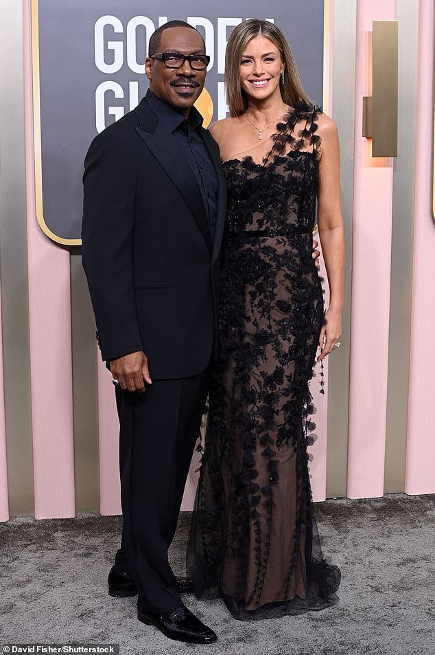 Posing on the arm of her actor husband, 61, the Australian model and actress, 42, oozed Hollywood glamor in a lace-covered black dress from fashion label Marchesa.