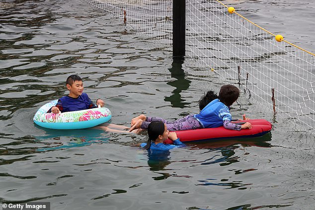 Kids on boogie boards and inflatables were seen trying out the new pool on Wednesday.