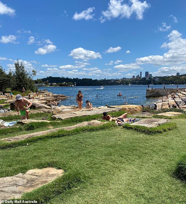 Those with a space on the lawn stretched out in the sun while curious office workers still in their corporate gear came to dip their toes in the water.