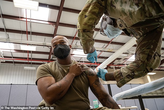 Preventive Medicine Services NCOIC Sergeant 1st Class Demetrius Roberson administers a COVID-19 vaccine to a Soldier September 9, 2021 at Fort Knox, Kentucky