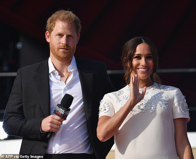 Prince Harry, pictured with the Duchess of Sussex in 2021, has continued to wear the leather pendant for the past decade.