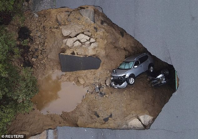 Several people had to be rescued after two vehicles plummeted into a sinkhole in Chatsworth, California.