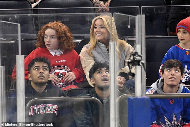 Fan Favorite: Jake Krakowski watched the game with his 11-year-old son Bennett.