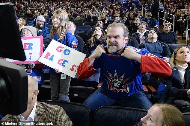 Into it: The actor donned the Rangers jersey during the tight game