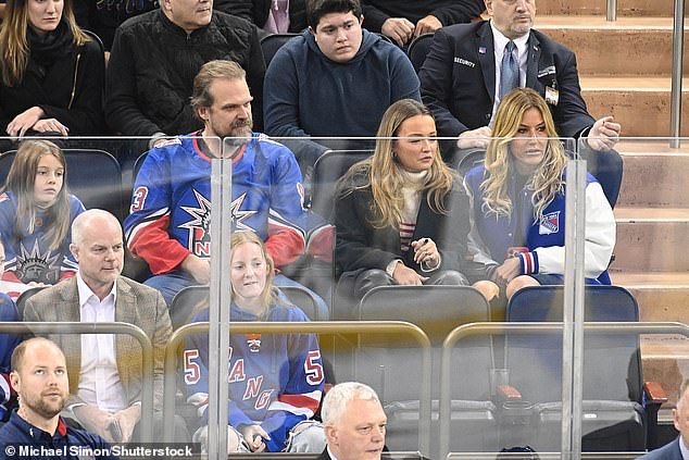 Watching: Kelly, Thaddeus and David watched the action on the ice.