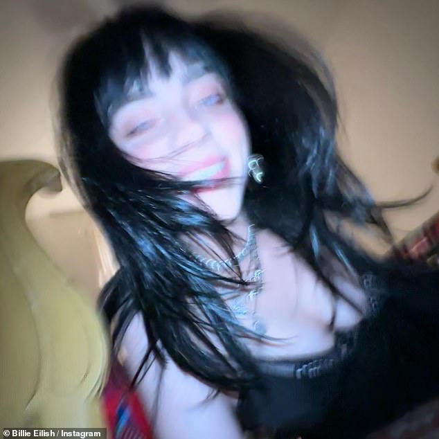 Necklaces: In the photos she shared, Eilish was lounging in her bedroom in the skimpy black dress with several chunky necklaces wrapped around her slender neck