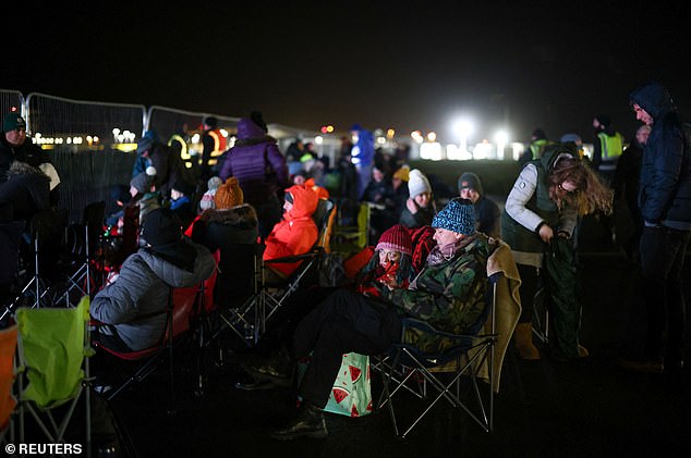 Spectators (pictured) whooped and danced to Start Me Up by the Rolling Stones as the jet took off, with people climbing onto each other shoulders to witness a moment which had promised to deliver the birth of a home-grown space launch industry