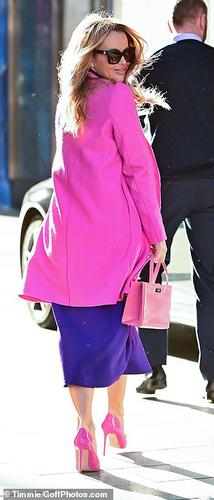 Details: Accessorizing, she carried a pink Barbie handbag and showed off every inch of the celeb with a pair of oversized sunglasses.