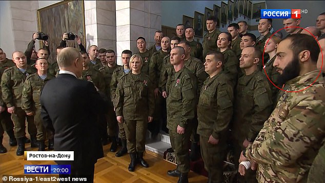 In the photo, Putin is meeting with fighters in Rostov-On-Don, some of whom are criminals released from prison to serve on the front lines.  Gasparyan is in a circle.  Some of the people in this image, including the blonde woman standing directly in front of Putin, have been identified as actors who have appeared in various Kremlin propaganda pieces.