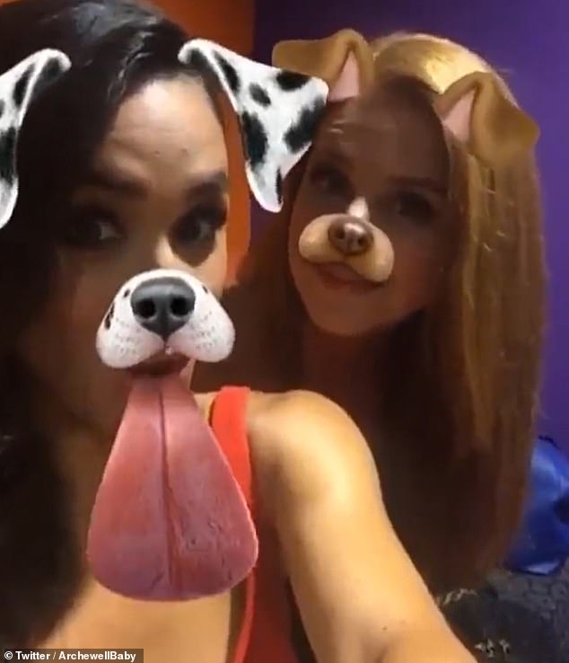 In the short clip, Meghan and Sarah don dog ears and noses, with long pink tongues wagging as they smile.