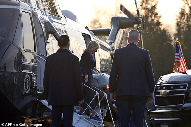 The first lady steps out of Marine One at the National Military Medical Center in Bethesda.