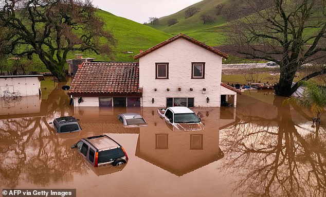 A flooded home is seen partially underwater in Gilroy, California this week.  Forecasters warned of flooding as a parade of storms that have killed at least 17 people battered the western United States.