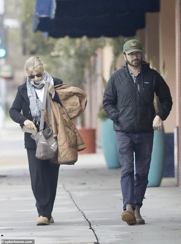 Walking: The actor was seen with his mother while walking down the street