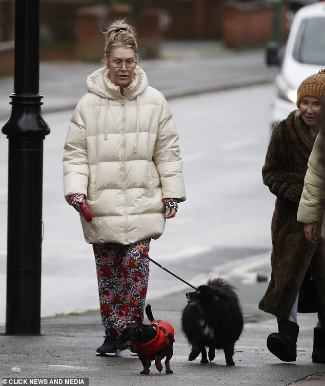 Don't stop moving!  Jo's little Pomeranian trotted happily beside her.