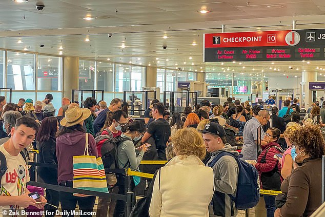 Passengers at Miami International Airport on Wednesday after an FAA 'computer glitch' halted all flights for several hours and delayed thousands of flights in the United States.