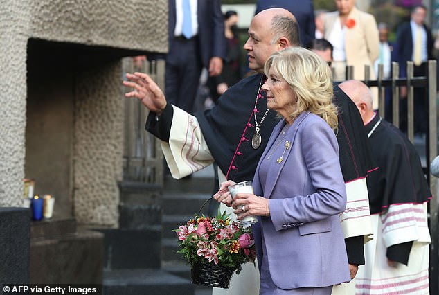 First Lady Jill Biden listens to Monsignor Salvador Martinez during her visit to the Basilica of Guadalupe in Mexico City, where she stopped after arriving in Mexico on Sunday.