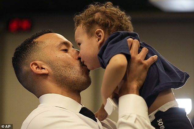 Correa kisses her son Kylo, ​​1, after a news conference at Target Field in Minneapolis