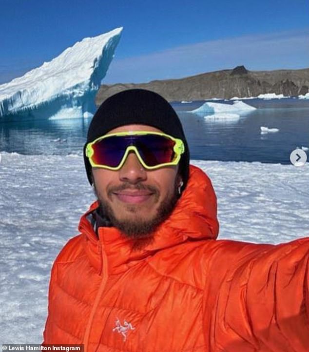 All smiles: It comes after he swapped the grid for glaciers the previous weekend to mark the milestone during a trip to Antarctica.