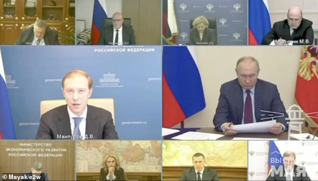 Putin (right) criticized Denis Manturov (left) in a government video conference for failing to procure military and civilian aircraft, January 12, 2023