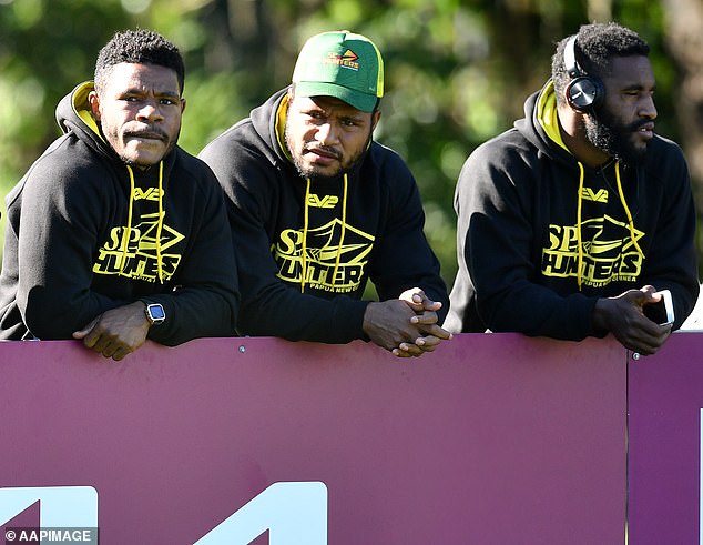 The PNG Hunters began playing in the Queensland Cup just under a decade ago, winning a premiership in 2017 (players pictured watching Brisbane Broncos training in 2021)