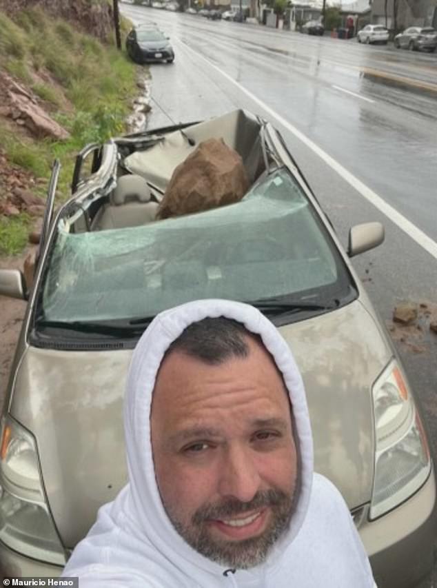 Henao took this photo with his vehicle after the rock fell on his car.