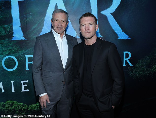 Bob Iger, the CEO of Disney, appears at the premiere of the new movie Avatar on December 12, with Sam Worthington.  Peltz insists that he does not intend to oust Iger, but the board resists Peltz's efforts to join the board.