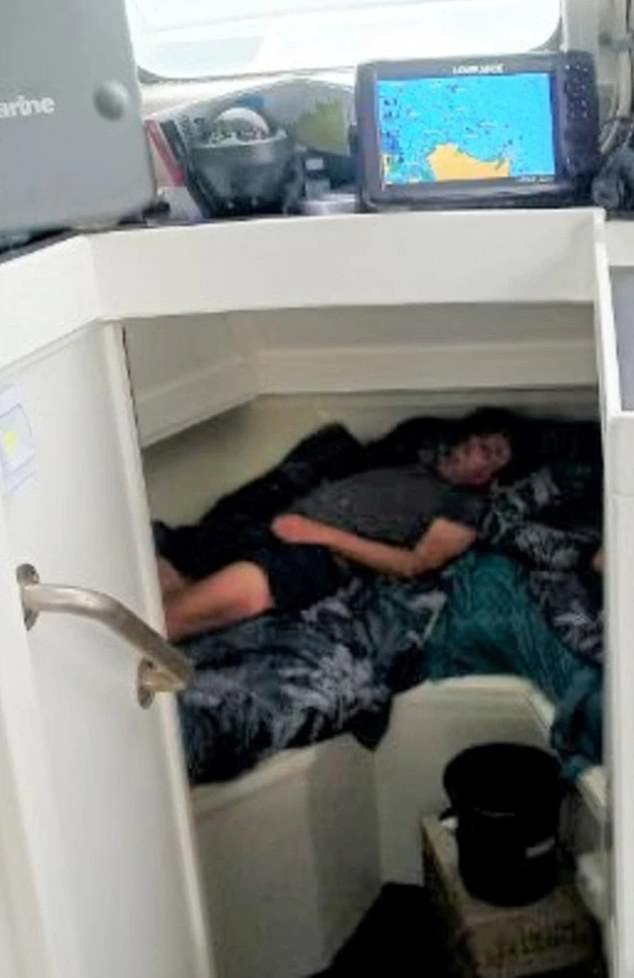 This photo shows the moment the Brisbane couple fell asleep in a fisherman's boat after spending three days lost at sea.